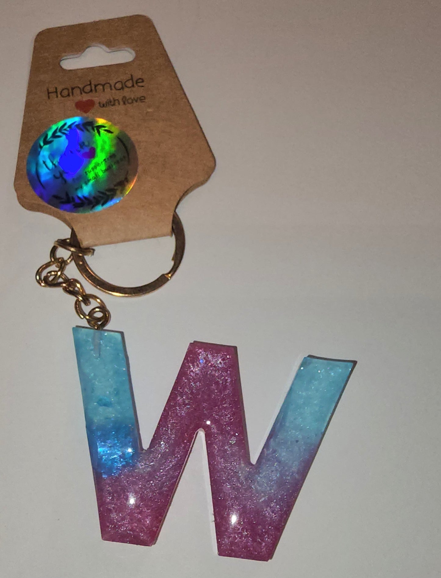 Epoxy alphabet keychains in various styles. I have  beach themes and mermaid colors. I have a few with rose pedals and gold flakes. All handmade by me and Locally handcrafted.