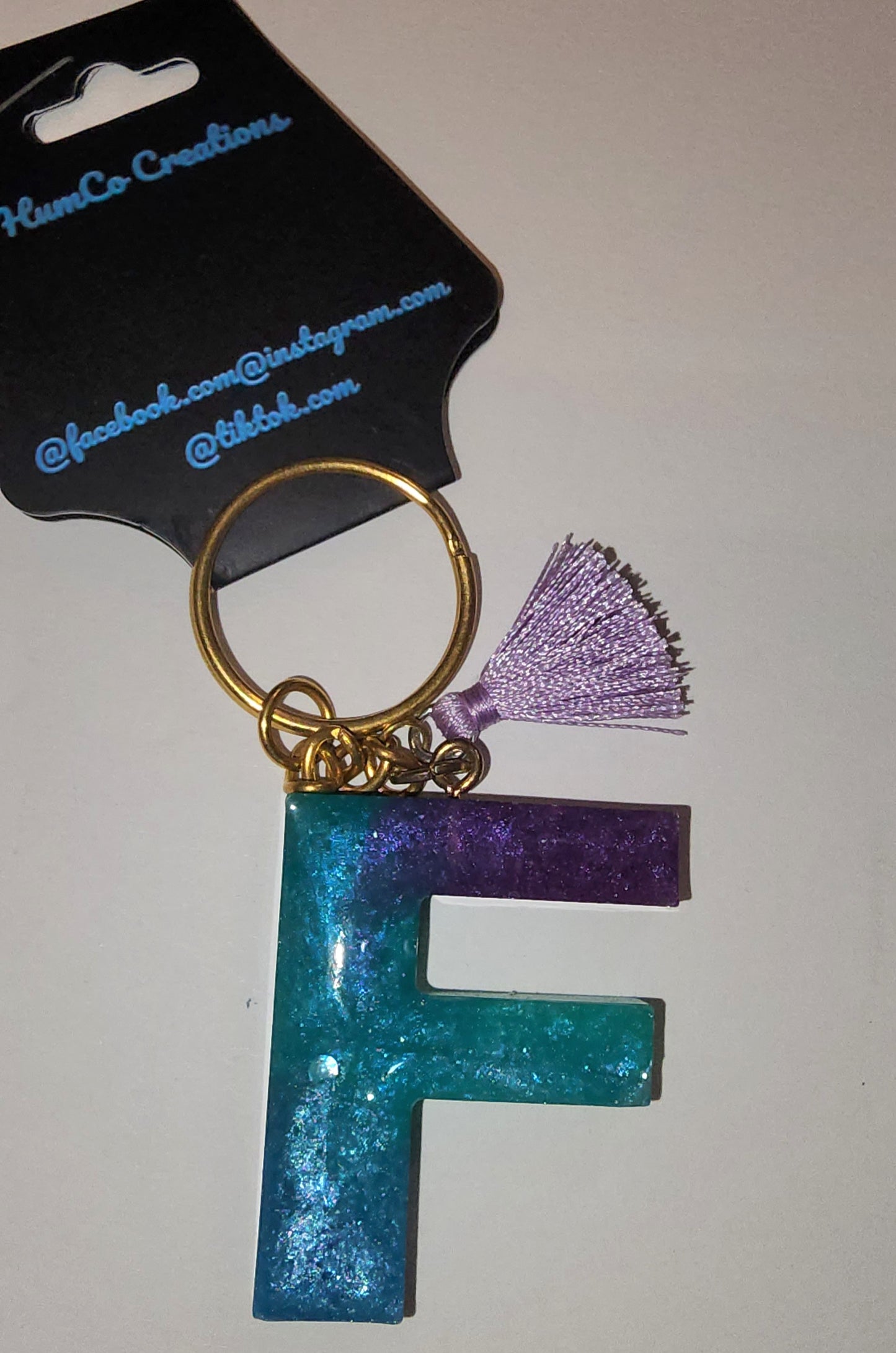 Epoxy alphabet keychains in various styles. I have  beach themes and mermaid colors. I have a few with rose pedals and gold flakes. All handmade by me and Locally handcrafted.